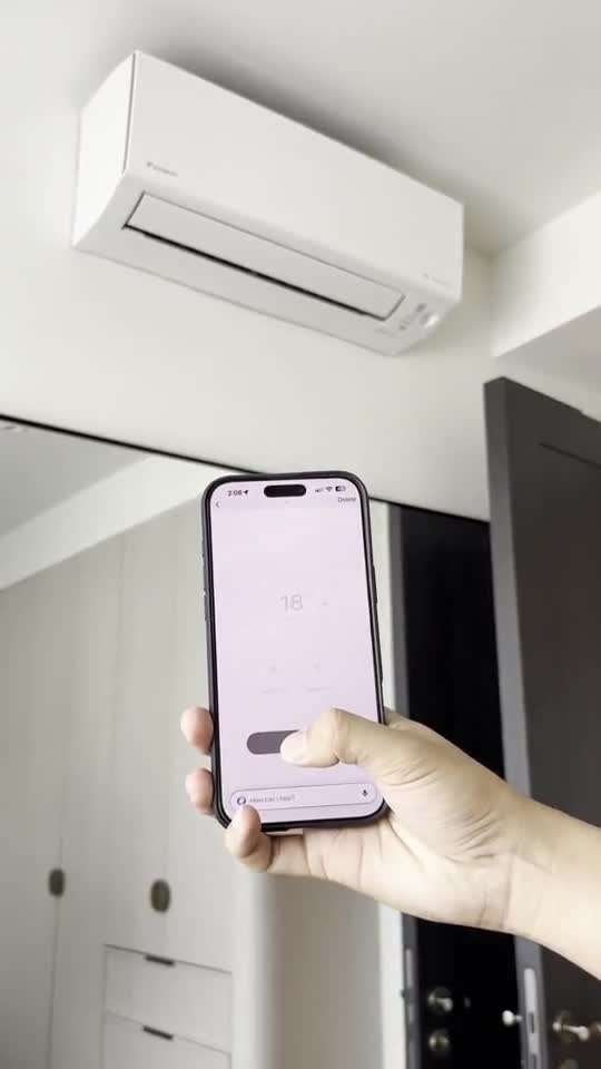 Phone control beside a wall-mounted air conditioner