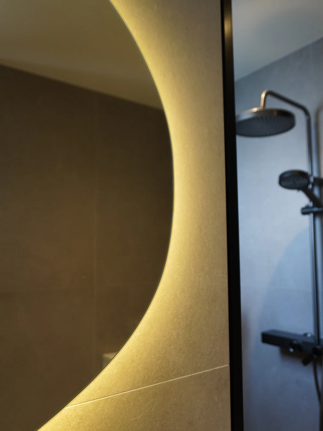 Backlit mirror and bathroom lighting detail